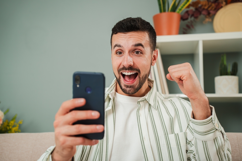 Young,Man,Celebrating,That,He,Has,Won,A,Sports,Bet